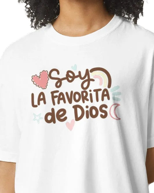 White t-shirt with 'Soy La Favorita de Dios' text and decorative elements on a transparent background