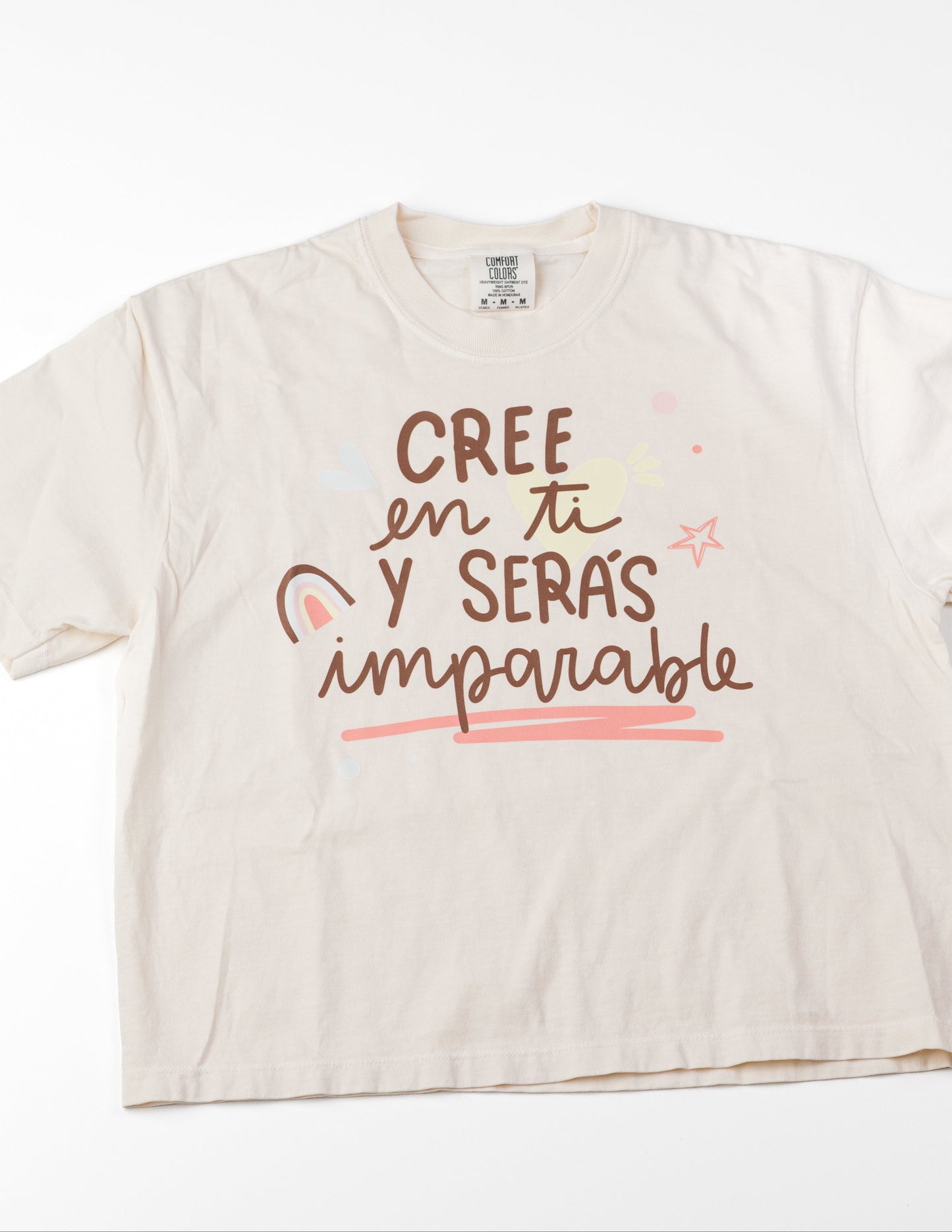 Beige t-shirt with motivational text on a white background