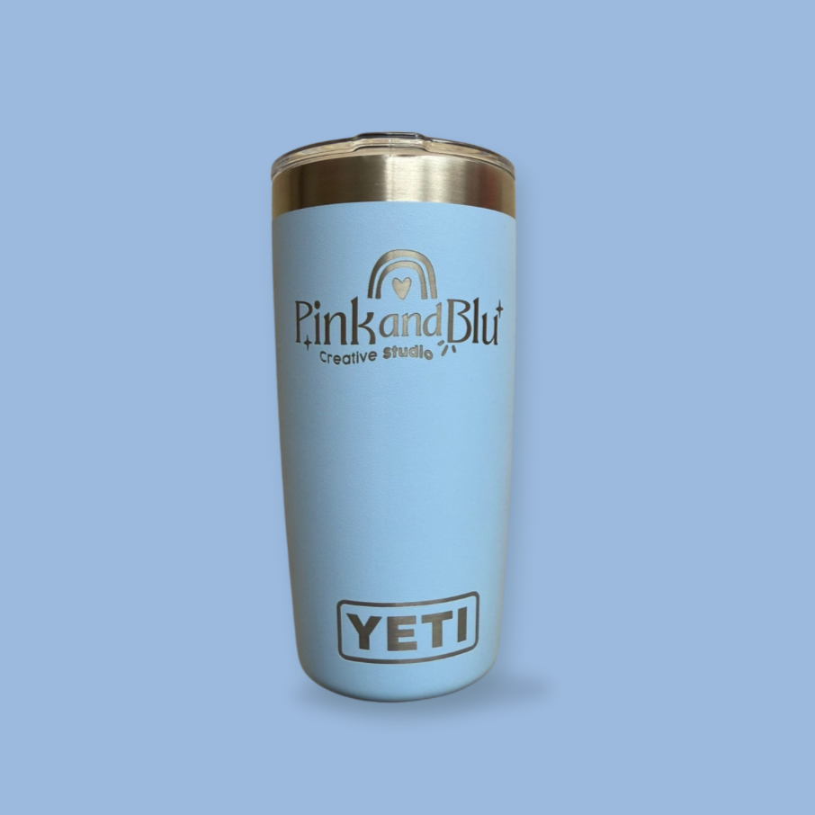 Light blue Yeti tumbler with gold lid on a light blue background