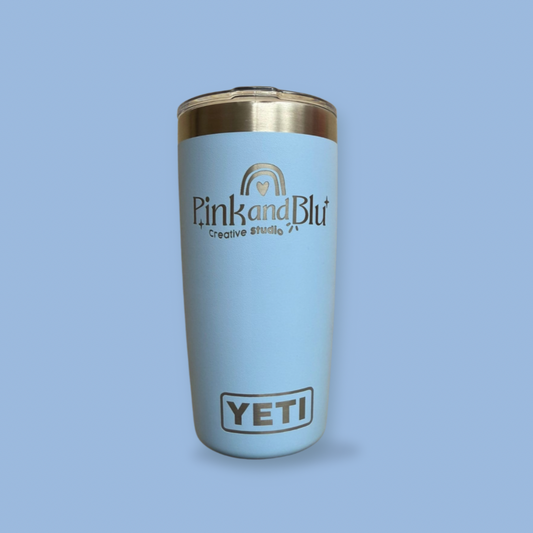 Light blue Yeti tumbler with gold lid on a light blue background