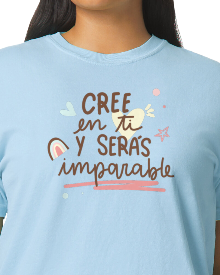 Light blue t-shirt with motivational text and graphics worn by a person