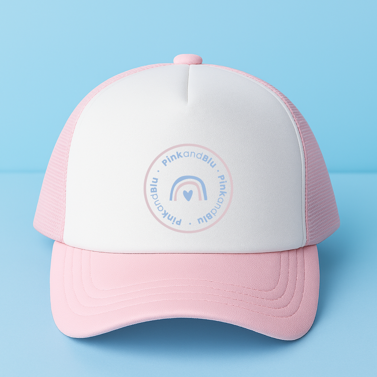 Pink and white cap with a logo on a light blue background