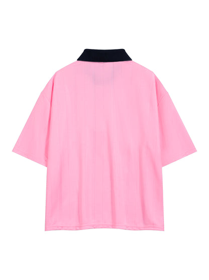Pink garment with black collar on a white background