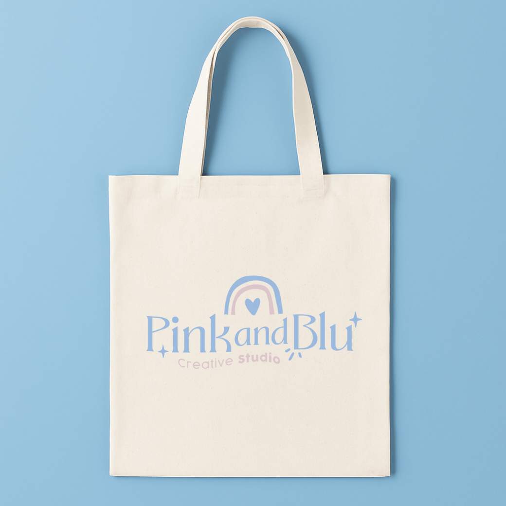 Tote bag with 'Pink and Blu Creative Studio' logo on a blue background