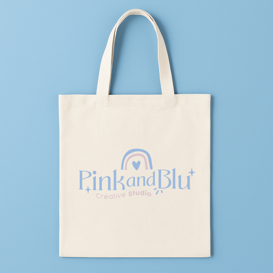 Tote bag with 'Pink and Blu Creative Studio' logo on a blue background